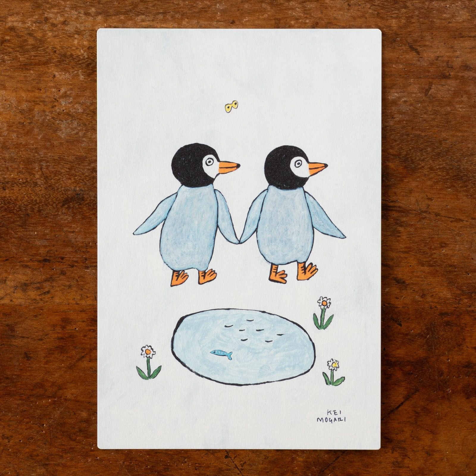 2匹のペンギンが手を繋いでいるデザイン