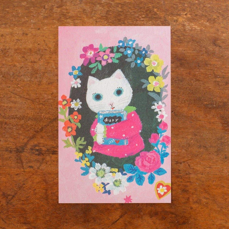 しろねことお花が描かれたデザイン