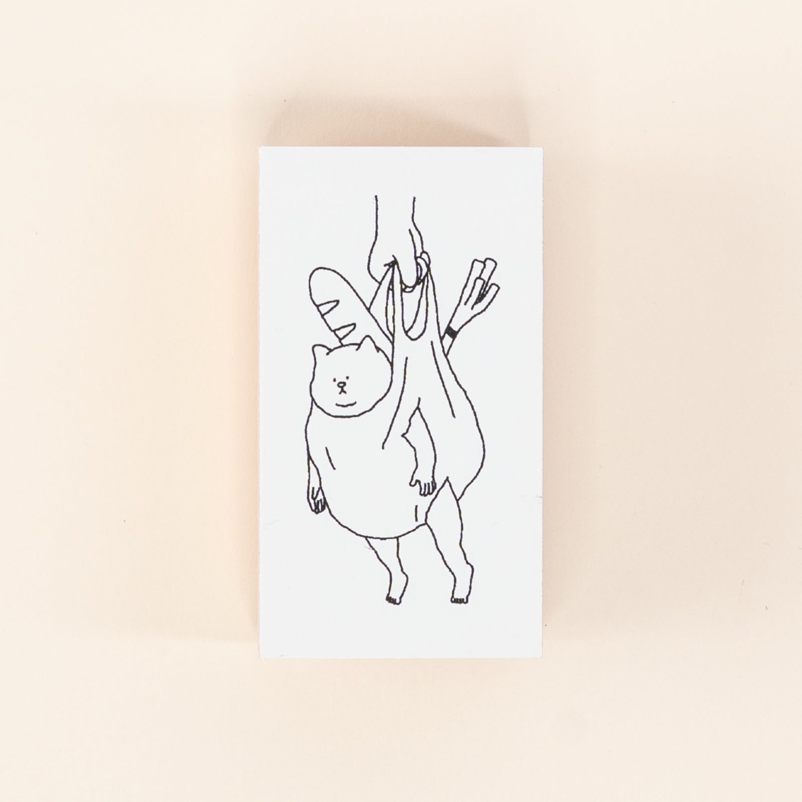 ねこがレジ袋に入れられてぶら下がっている面白いデザイン