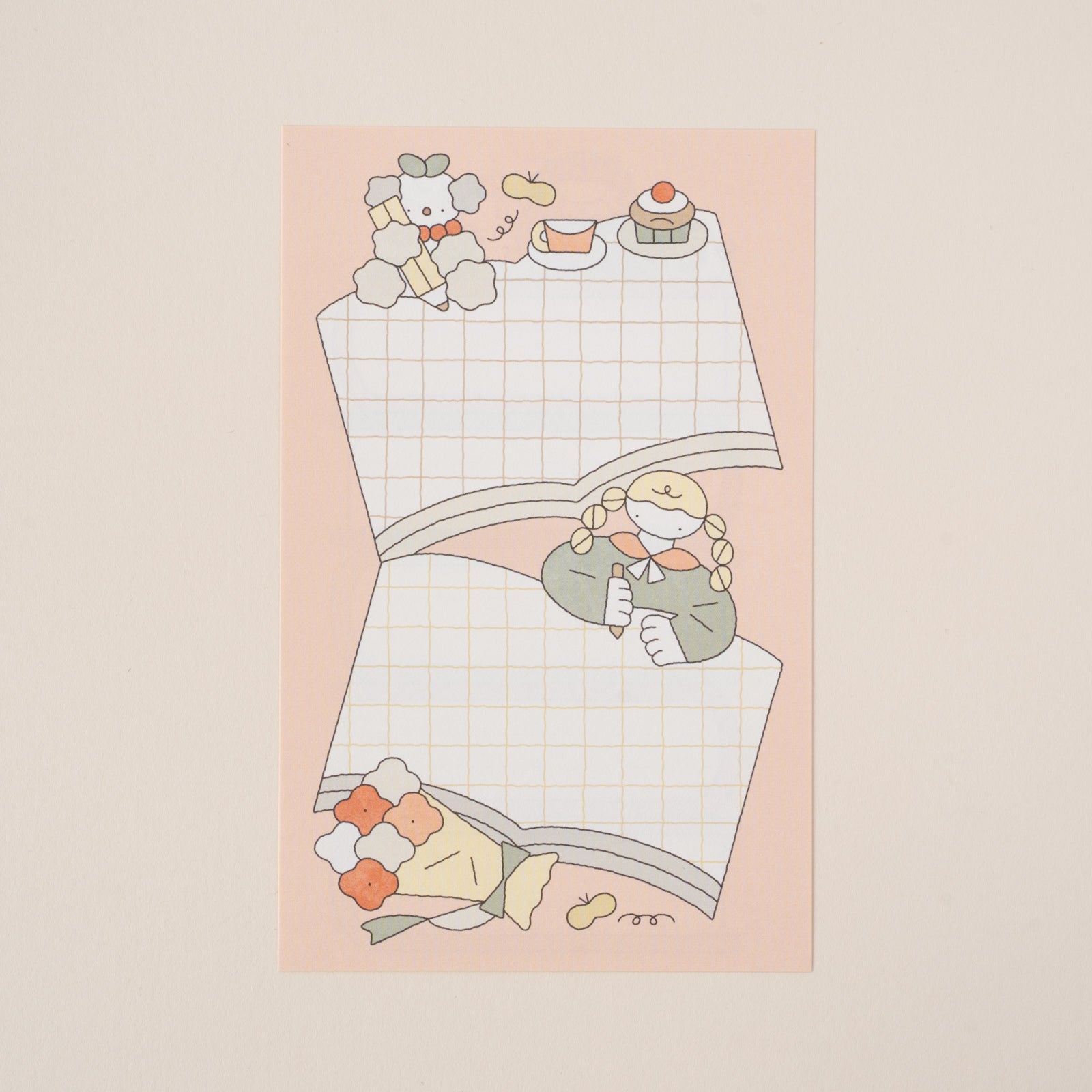 本とおさげ姿の女の子が描かれたデザイン