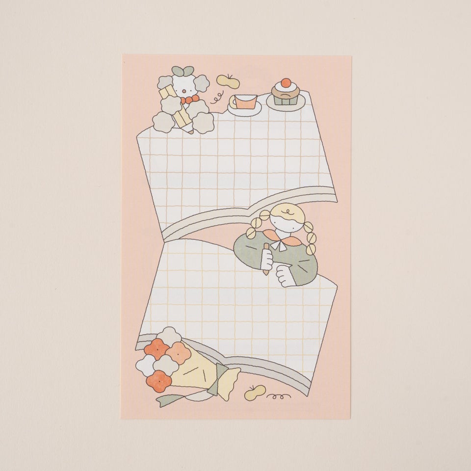 本とおさげ姿の女の子が描かれたデザイン