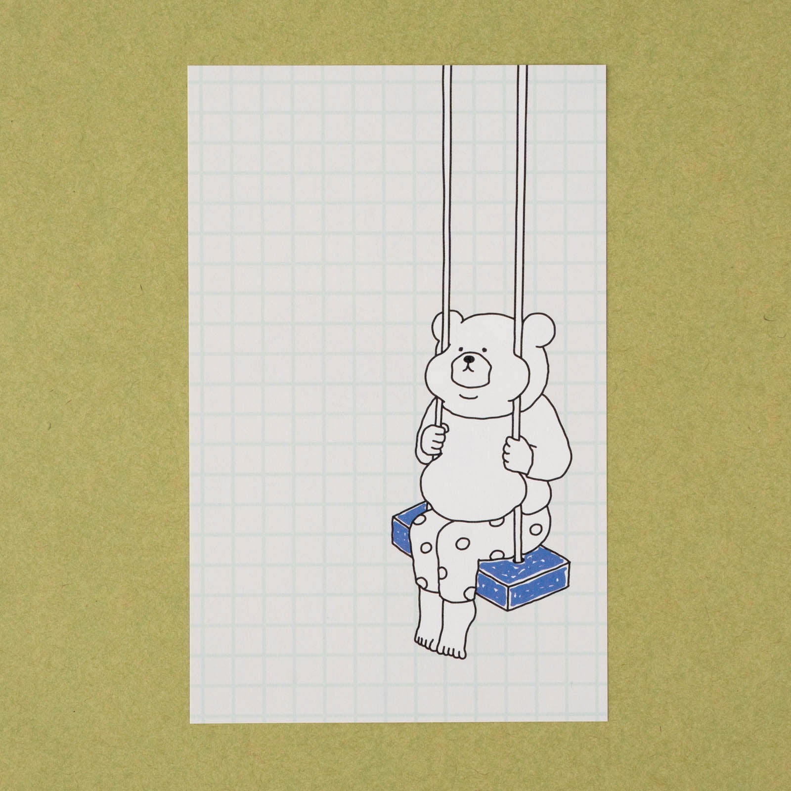 ブランコに乗ったくまが描かれたデザイン